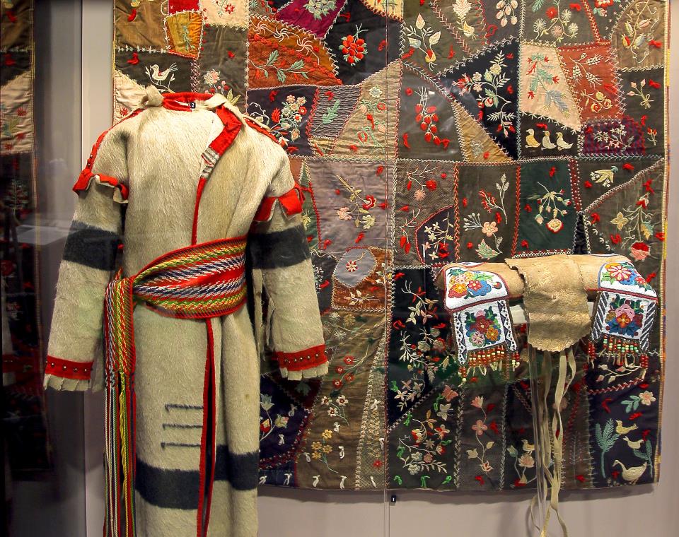 A Metis sash, coat, quilt, and saddle