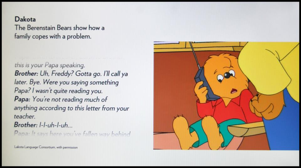 A photo of brother bear from Berenstain Bears holding a phone up to his ear