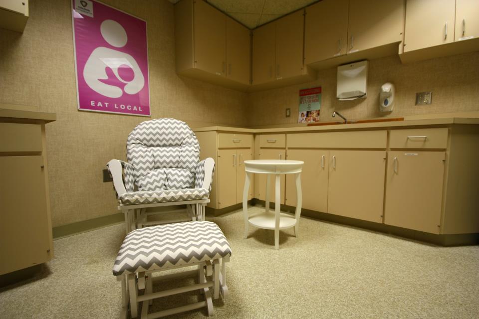 Chair, table, sink, and poster that says Eat Local