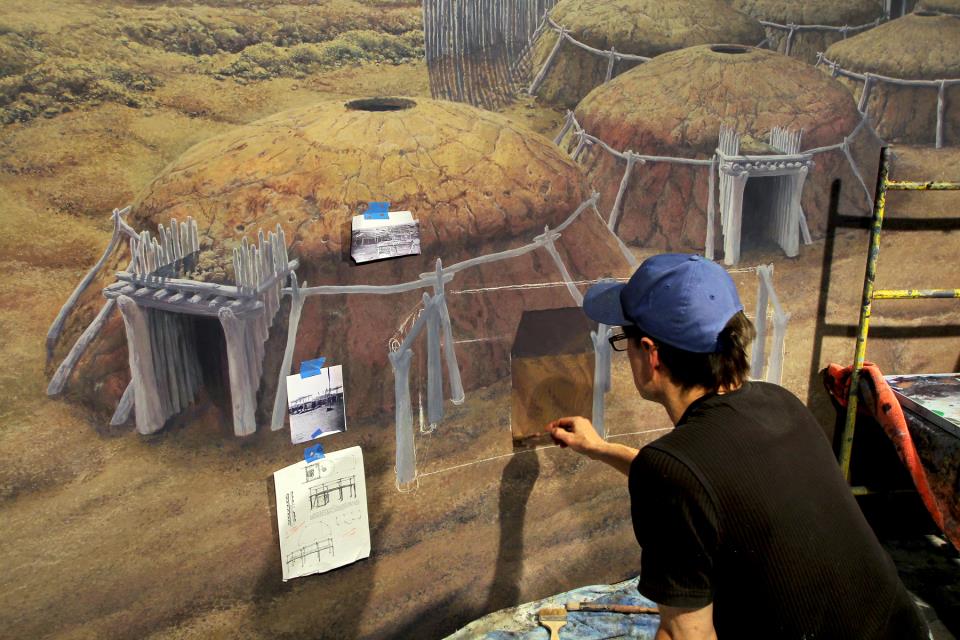 Artist Rob Evans painting the Double Ditch Indian Village cyclorama