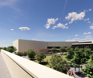 An outdoor view of a rendering of a tan building with many trees in between the building structures.